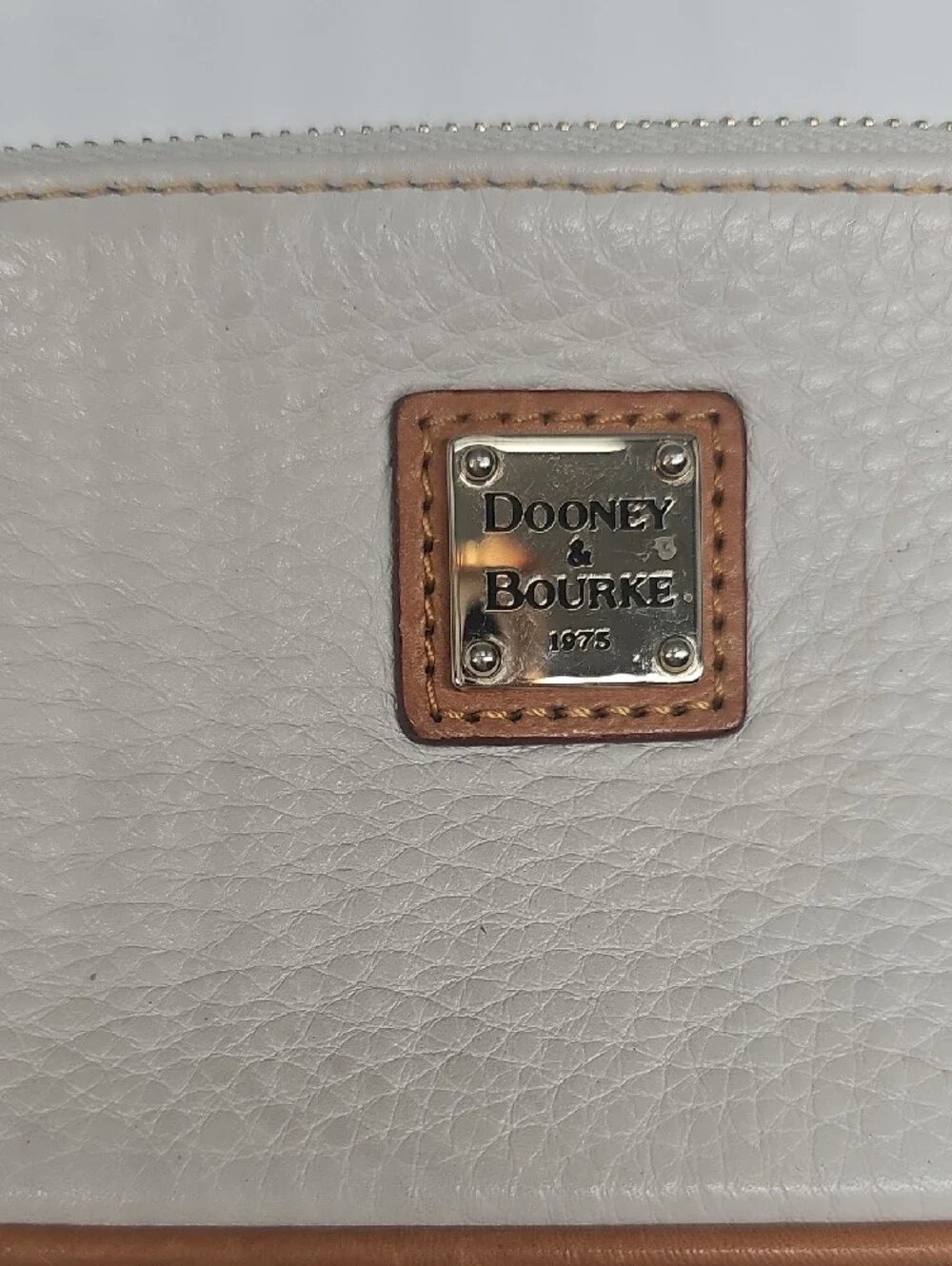 Dooney & Bourke Cream Leather Pouch